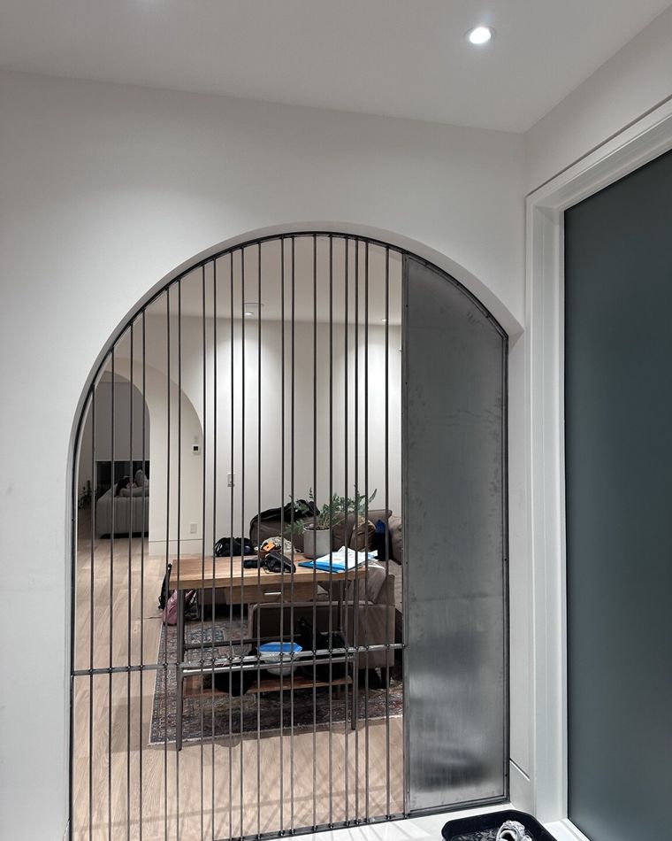 The same arched steel screen built and installed in the opening.