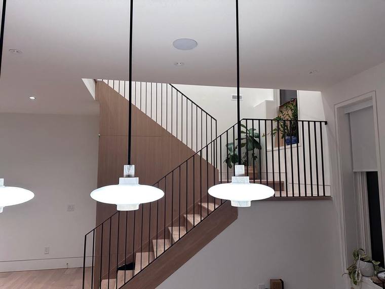 Thin-picket steel guard over an open stairwell.