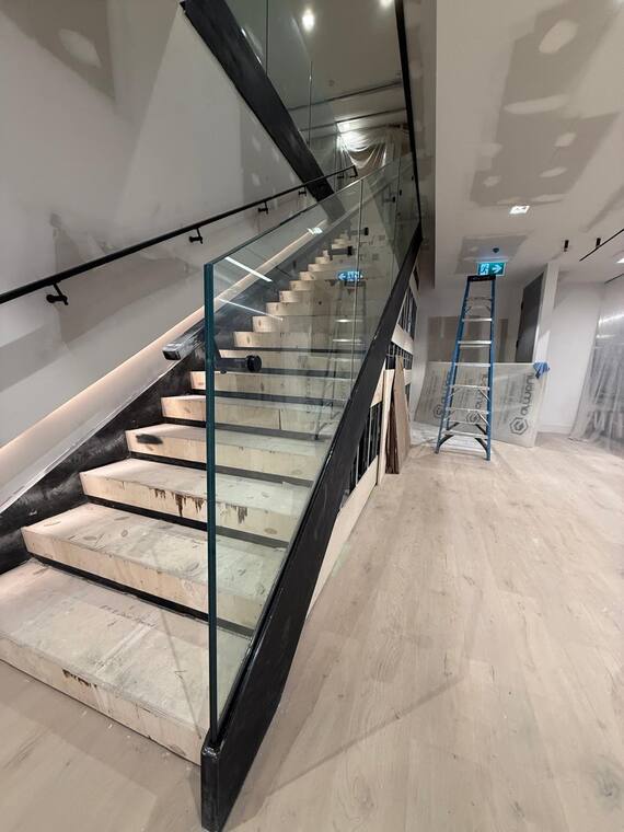 Glass guard on a commercial stair.