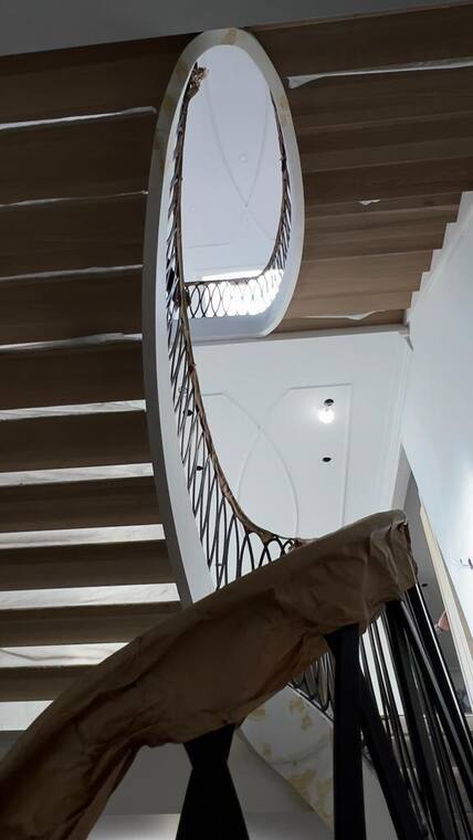 Oval stair opening seen from below.