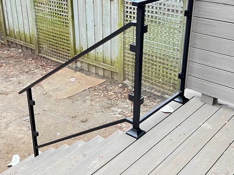 Aluminum and glass railing on a composite deck.